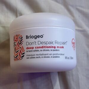 Briogeo White Hair Mask Jar with Red and Orange Leaf Accent